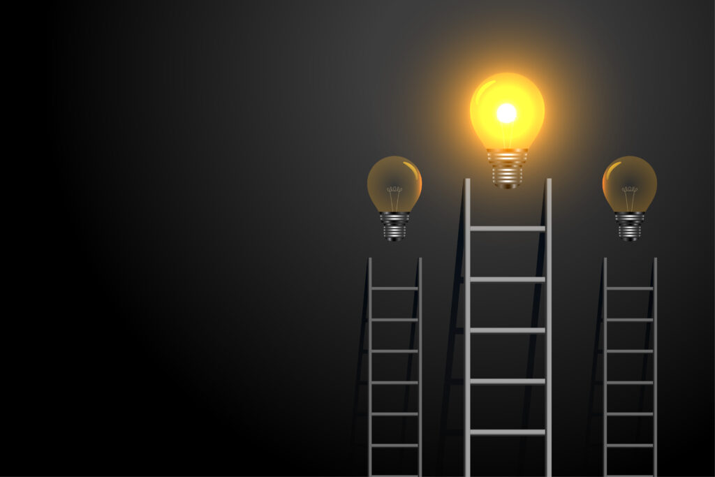 success concept ladder with glowing light bulb